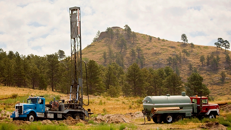 Two trucks in a field